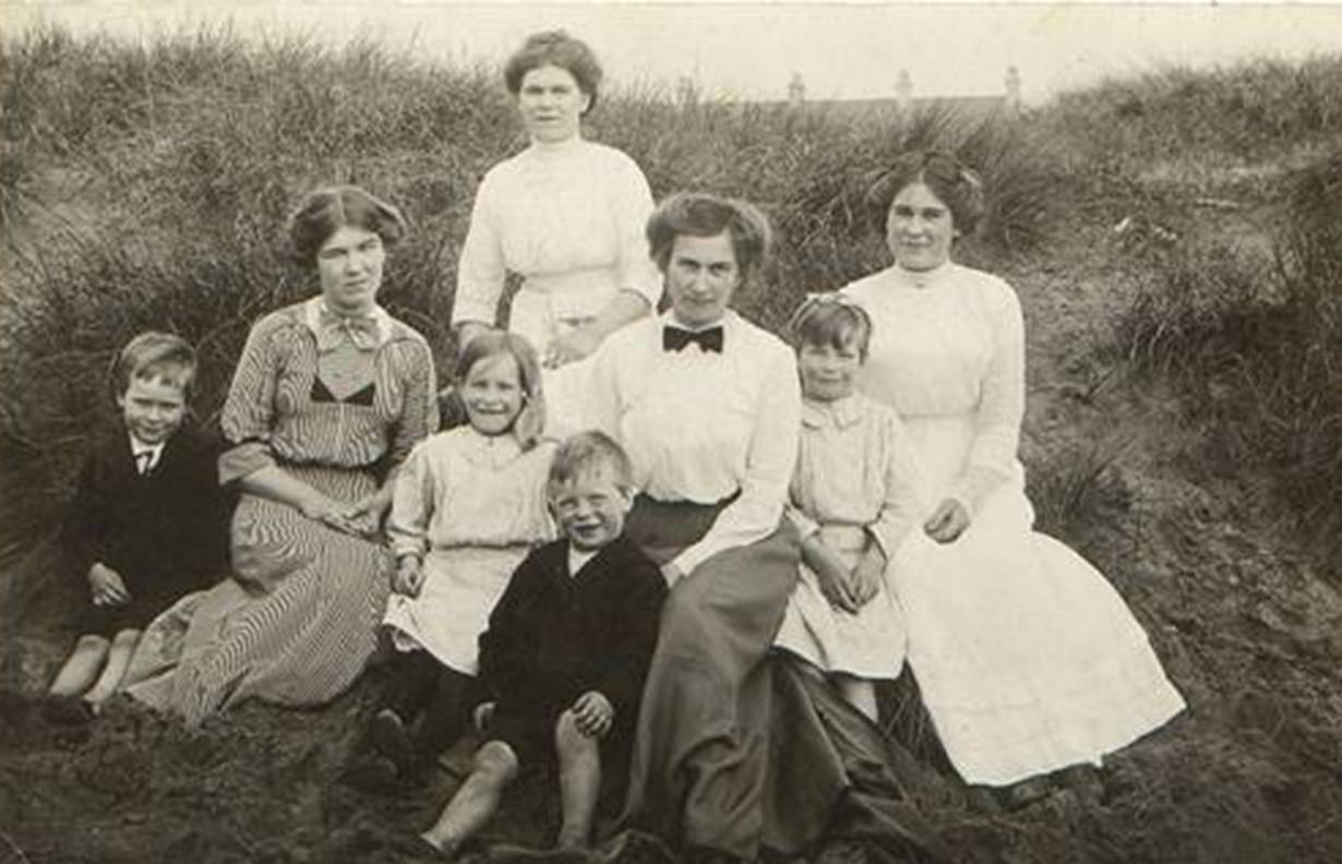 A group of people posing for a photo
Description automatically generated